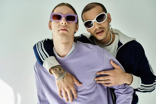 Two attractive men standing closely together, sharing a moment of connection. — Stock Photo