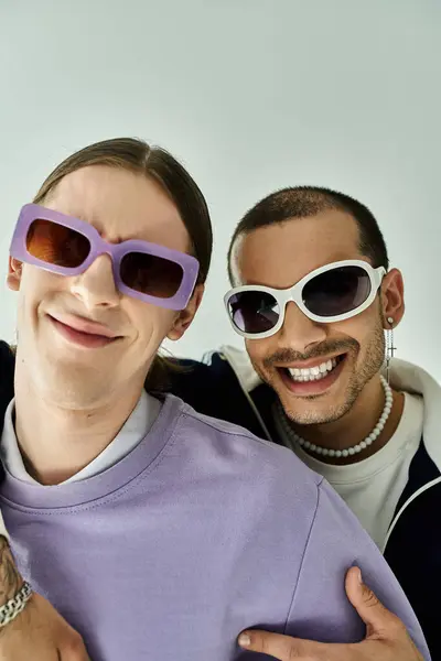A charming gay couple pose together exuding love and happiness. — Stock Photo