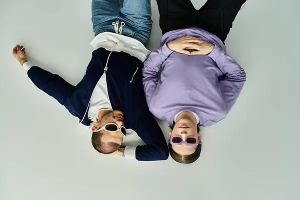 A couple of people, an attractive gay couple, laying on top of each other, spending quality time together. — Stock Photo