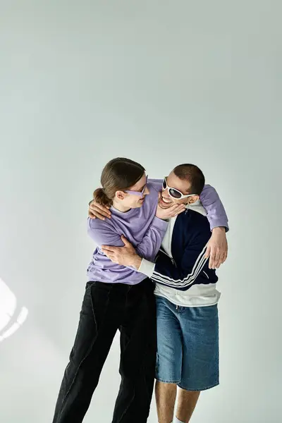 A gay couple sharing a warm embrace. — Stock Photo
