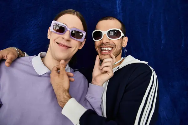 Two stylish men standing close together, enjoying each others company. — Stock Photo