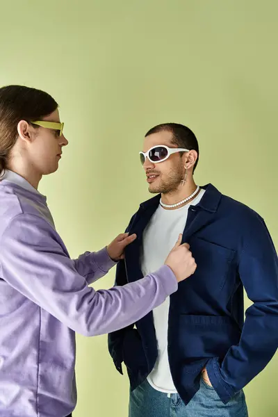 Two men stand peacefully before a vibrant yellow backdrop. — Stock Photo