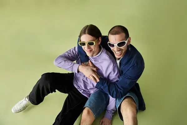 Two men seated intimately intertwined, displaying unity and harmony. — Stock Photo