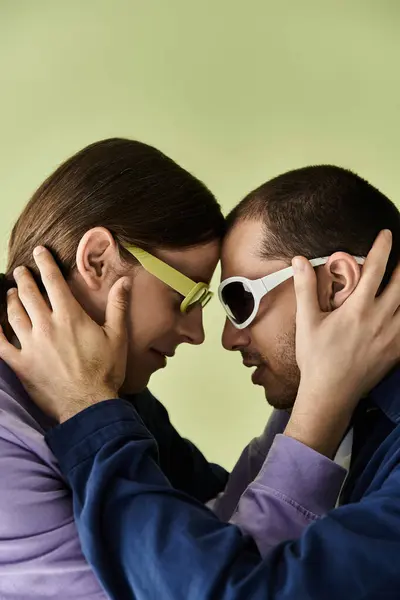 A stylish gay couple standing side by side. — Stock Photo