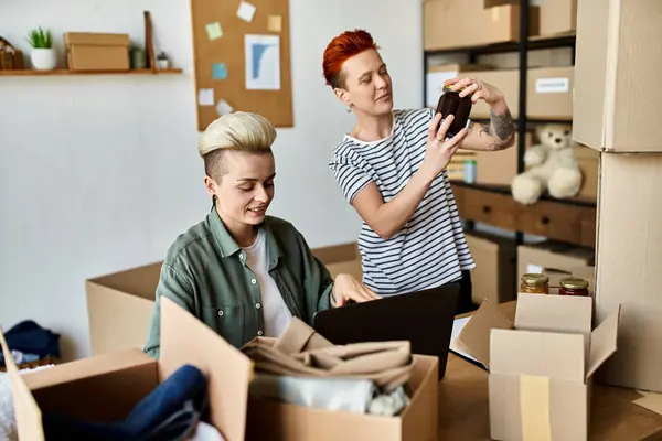 A young woman takes a picture near her partner in volunteer center — Stock Photo