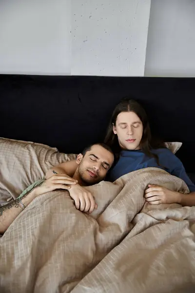 A young gay couple sleeps peacefully in their bedroom. — Stock Photo