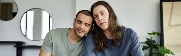 Two young men, a gay couple, relax in a bedroom with a calming atmosphere. — Stock Photo