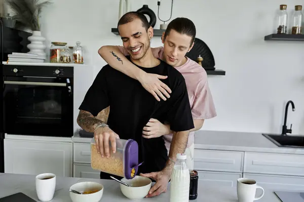 A young gay couple enjoys a cozy morning together, preparing cereal in their modern kitchen. — Stock Photo
