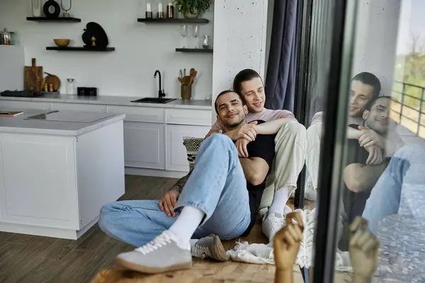 A young gay couple enjoys a moment of intimacy and affection in their modern home. — Stock Photo