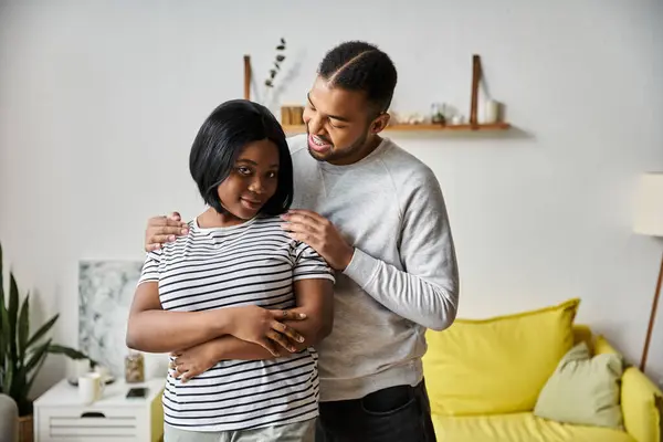 African american couple expresses love together in cozy home. — Stock Photo
