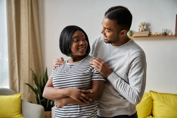 A loving African American couple shares a moment of intimacy at home. — Stock Photo
