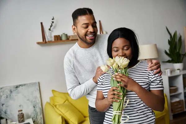 A loving African American couple shares a sweet moment at home. — Stock Photo