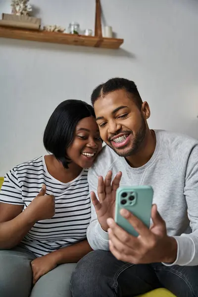 A couple is making a video call on a phone. — Stock Photo