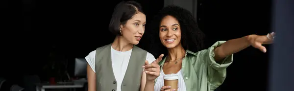 A lesbian couple works together in a modern office. — Stock Photo