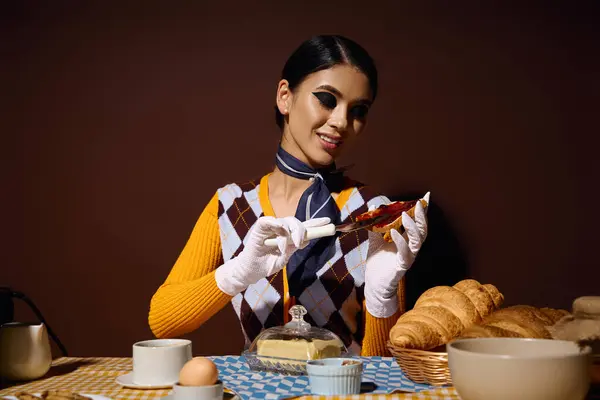 Stylish woman enjoys a breakfast of pastries and tea. — Stock Photo