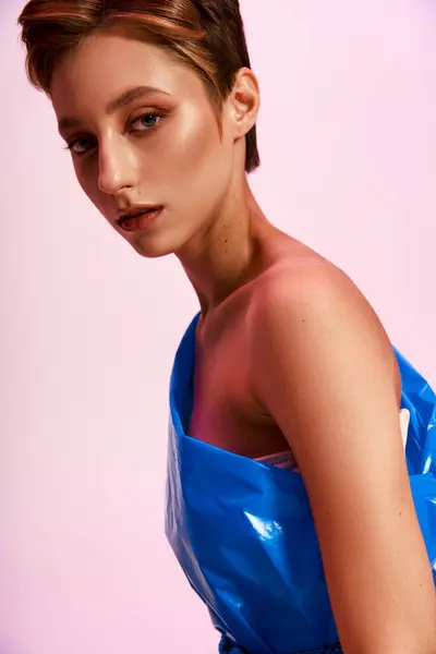 A woman models a one-shoulder top made from recycled materials. — Stock Photo