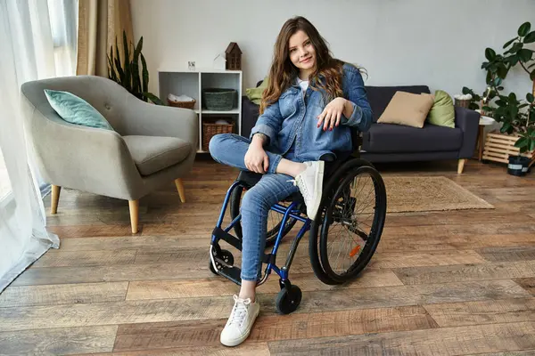 A young woman in a wheelchair sits confidently in her modern apartment, showcasing a life full of possibilities. — Stock Photo
