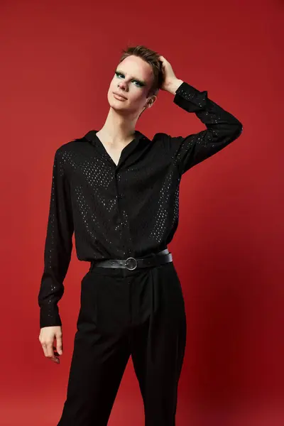 A young drag artist showcases stylish attire with a charismatic pose. — Stock Photo