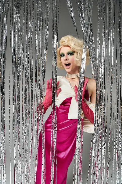 A vibrant young drag performer showcases their stylish look with flair. — Stock Photo