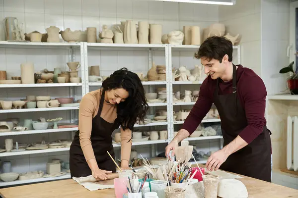 Loving partners enjoying pottery making in a bright, contemporary space. — Stock Photo