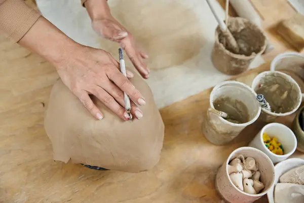 Young woman with nail polish making pottery. — Stock Photo