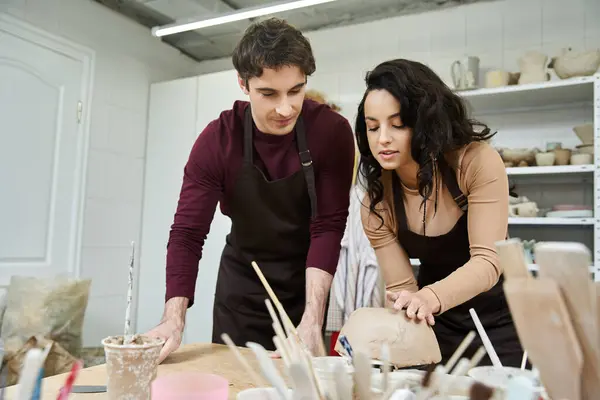 A couple joyfully crafts pottery in a bright, inviting studio. — Stock Photo