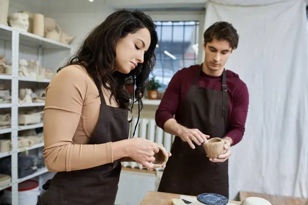 A couple crafts pottery together, sharing love and creativity in their art. — Stock Photo