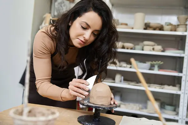 Talented trendy woman with apron making pottery. — Stock Photo