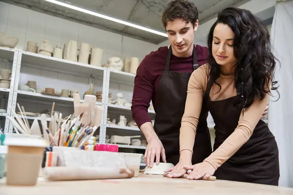 A couple crafts pottery with joy and creativity in their studio. — Stock Photo