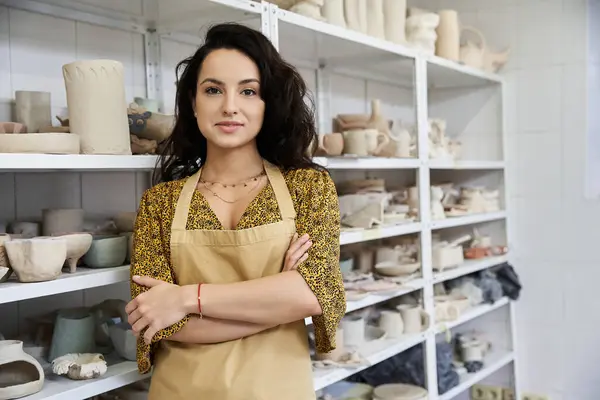 Young woman posing in pottery studio. — Stock Photo