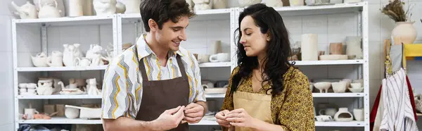 Loving partners create pottery together in a bright, contemporary studio space. — Stock Photo