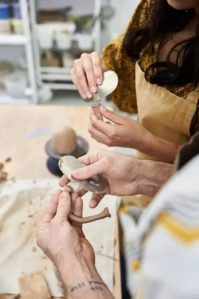 A couple crafts pottery, sharing laughter and creativity in a bright studio. — Stock Photo