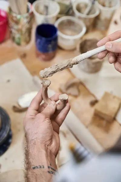 Hard working man making pottery in studio. — Stock Photo