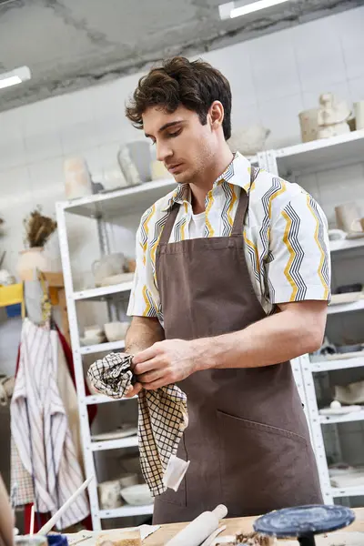Good looking man spending time in pottery studio. — Stock Photo