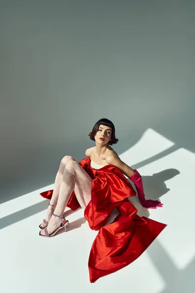 A stylish young woman showcases vibrant fashion with confidence and poise. — Stock Photo