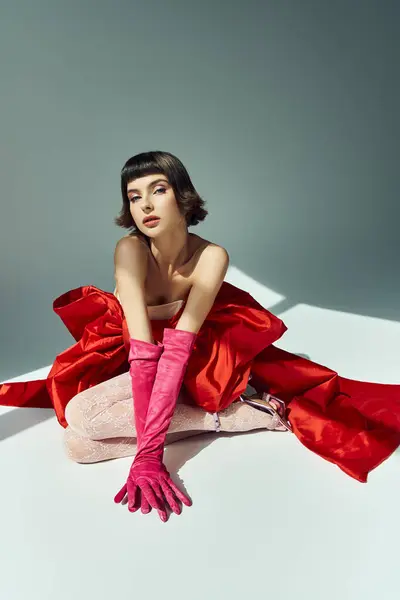 A stunning young woman showcases her stylish attire with grace and confidence. — Stock Photo