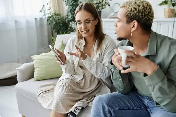 A non binary person and their friend share a moment of laughter and connection. — Stock Photo
