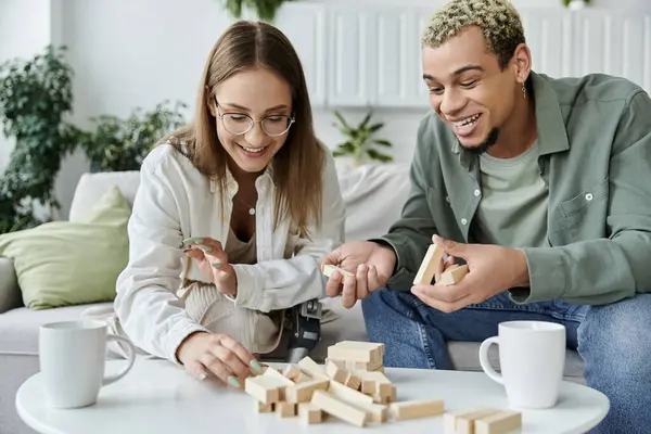 Two friends joyfully engage in a game while sharing laughter and conversation. — Stock Photo