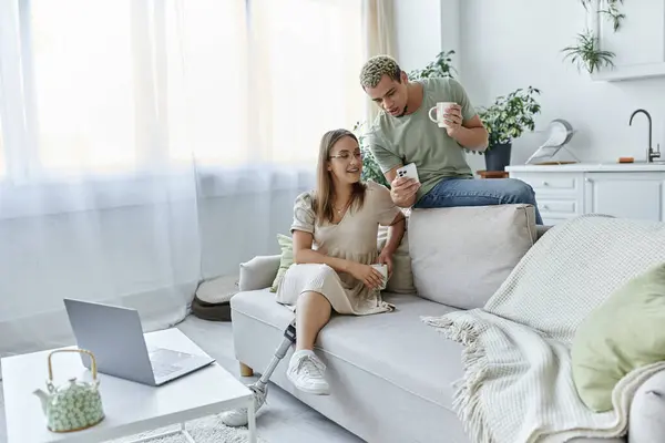 Two friends share a joyful moment while relaxing at home together. — Stock Photo