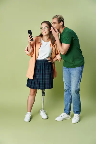 Friends share laughter while checking their phone together, enjoying quality time. — Stock Photo