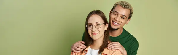 Two friends share a moment of happiness and support in a vibrant space. — Stock Photo