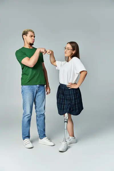 Friends connect through a joyful fist bump in a creative setting. — Stock Photo