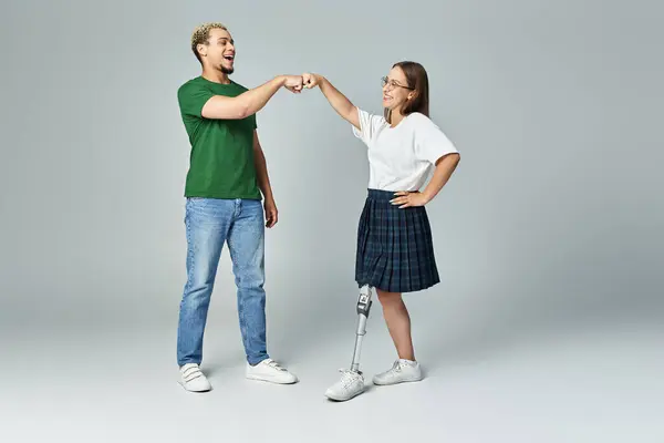 Two friends share a fun fist bump filled with joy and camaraderie. — Stock Photo