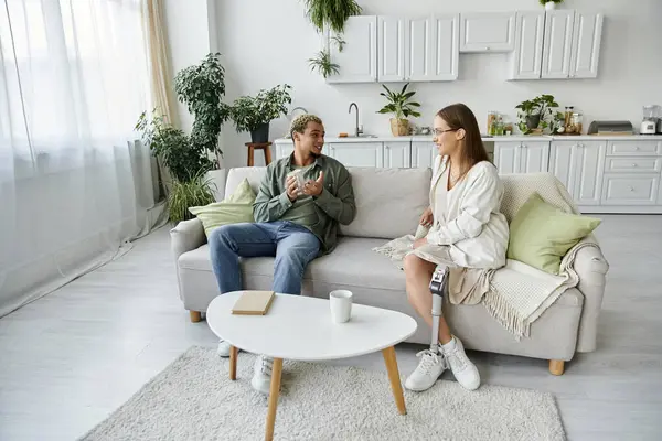 Two friends share laughter and companionship in a bright, modern space. — Stock Photo