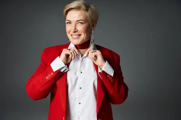 An elegant woman showcases her stylish attire with confidence, exuding charm and grace. — Stock Photo