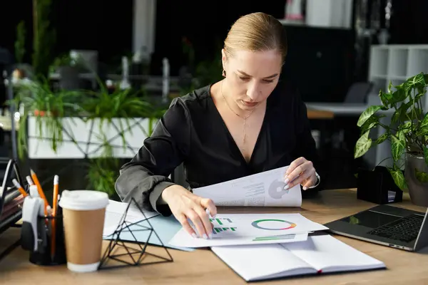 A young plus size woman diligently analyzes reports and data in a stylish office setting. — Stock Photo