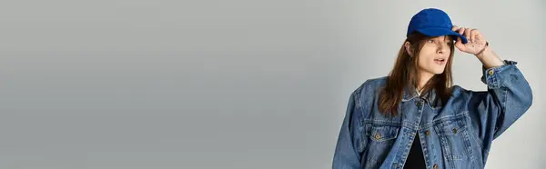 Stylish young guy poses confidently in fashionable denim attire, capturing a vibrant moment. — Stock Photo