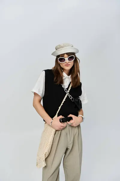 A stylish young individual showcases unique fashion choices with flair and confidence. — Stock Photo