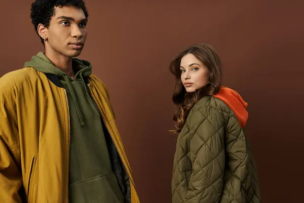 The fashionable duo showcases vibrant autumn attire, exuding warmth and style together. — Stock Photo