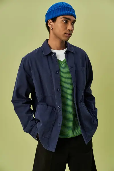A stylish man embraces the autumn vibe with colorful outfit. — Stock Photo